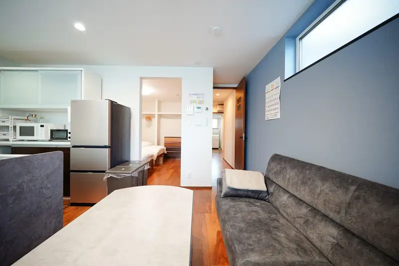 Looking from the living room toward the kitchen and hall